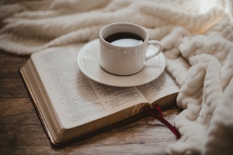 white ceramic cup on white ceramic saucer