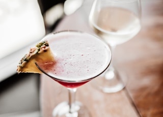 clear wine glass with red liquid