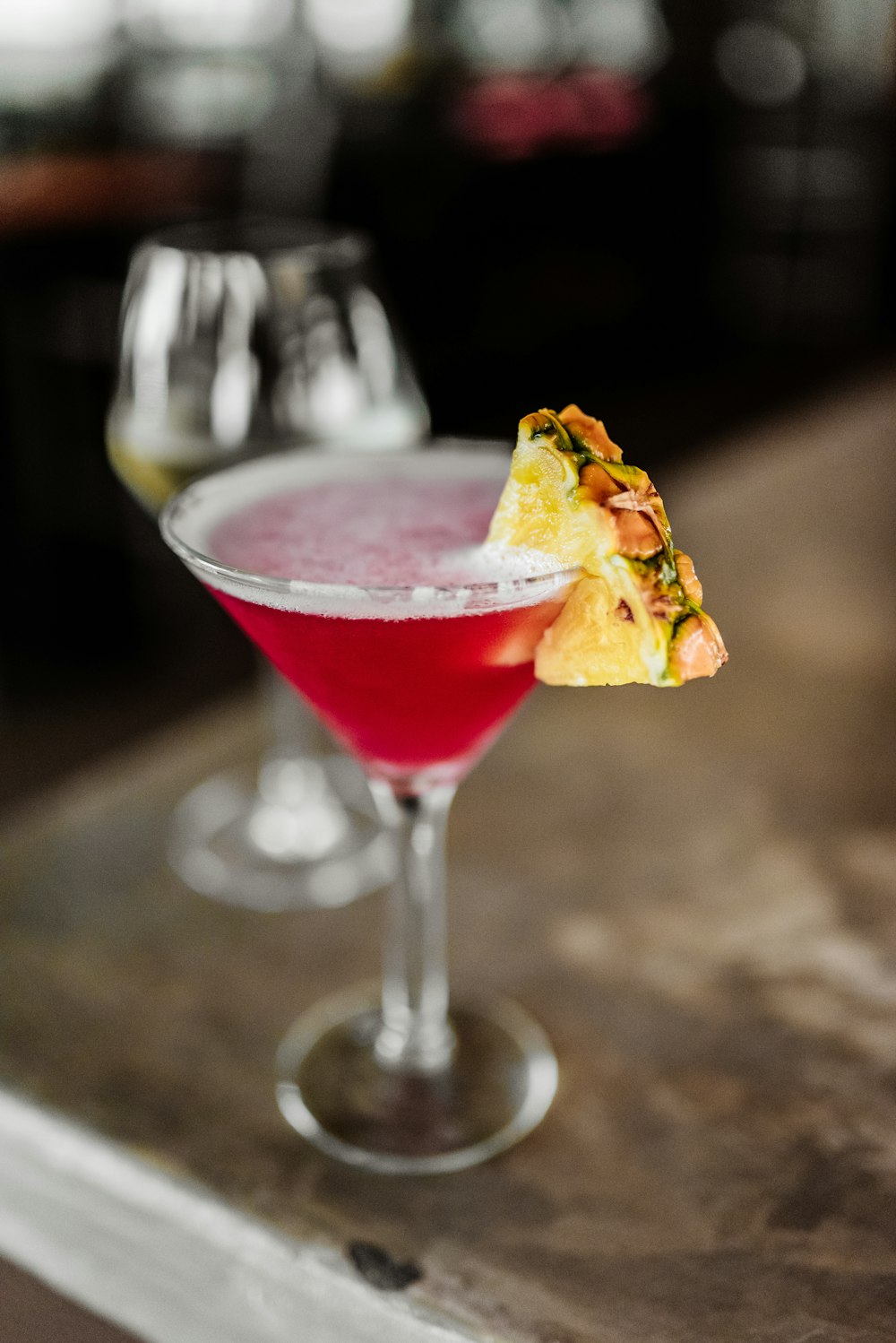 red liquid in clear cocktail glass