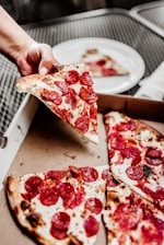sliced pizza on white ceramic plate