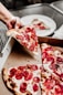 sliced pizza on white ceramic plate
