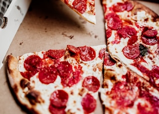 sliced pizza on white ceramic plate