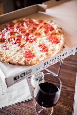 pizza on white cardboard box