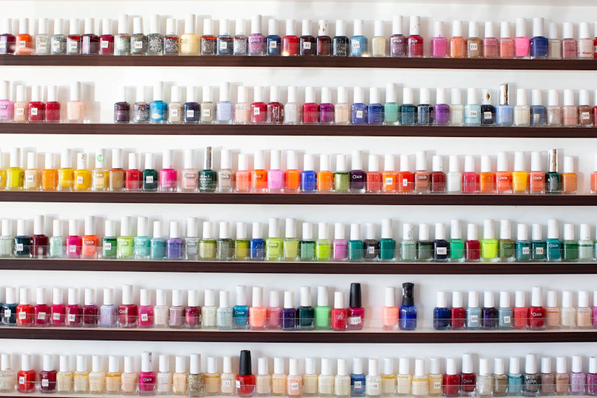 Rows of nail polish colors as a visual example of nail supplies