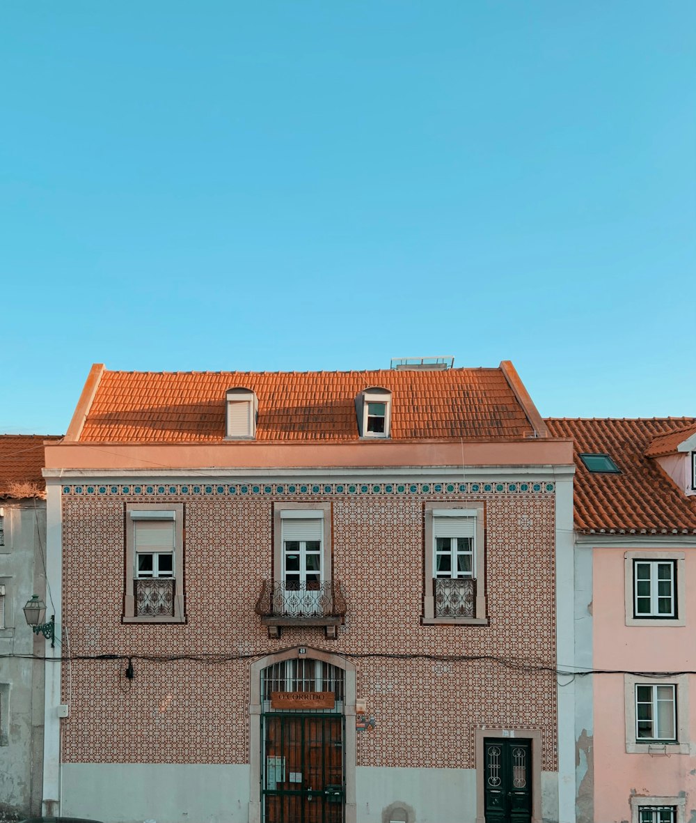 white and brown concrete building under blue sky during daytime