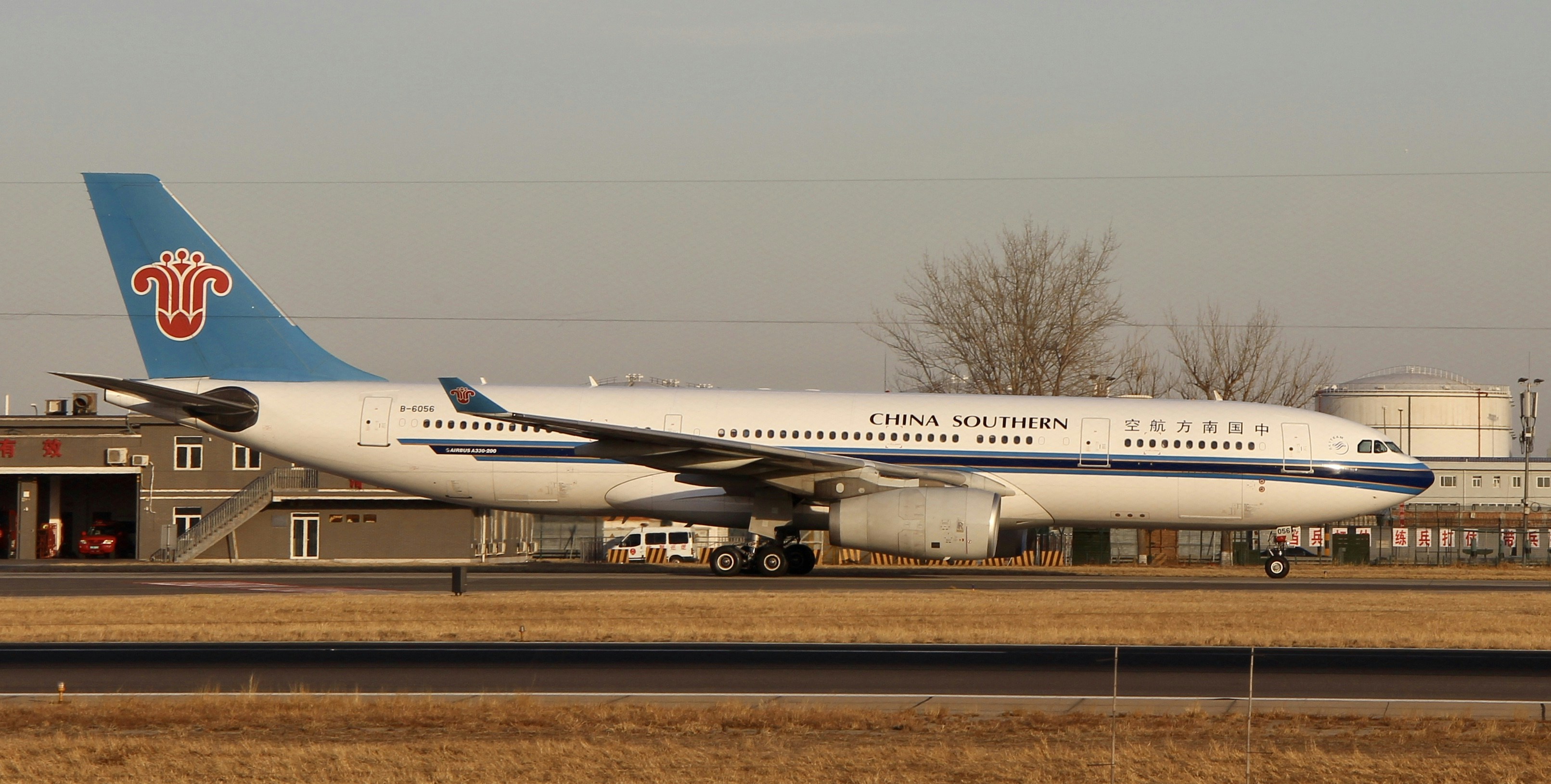 white passenger plane on airport during daytime, 