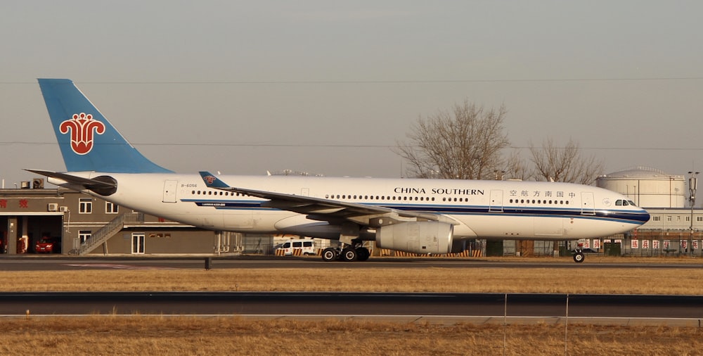 white passenger plane on airport during daytime