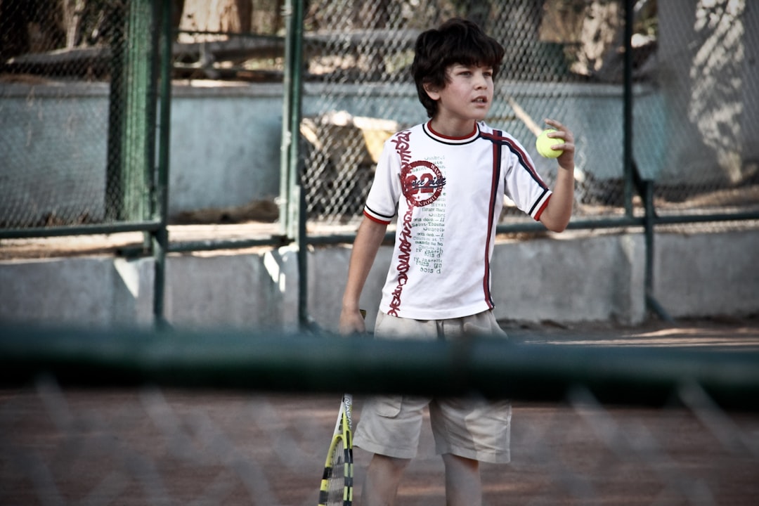 An Iranian boy playing tennis