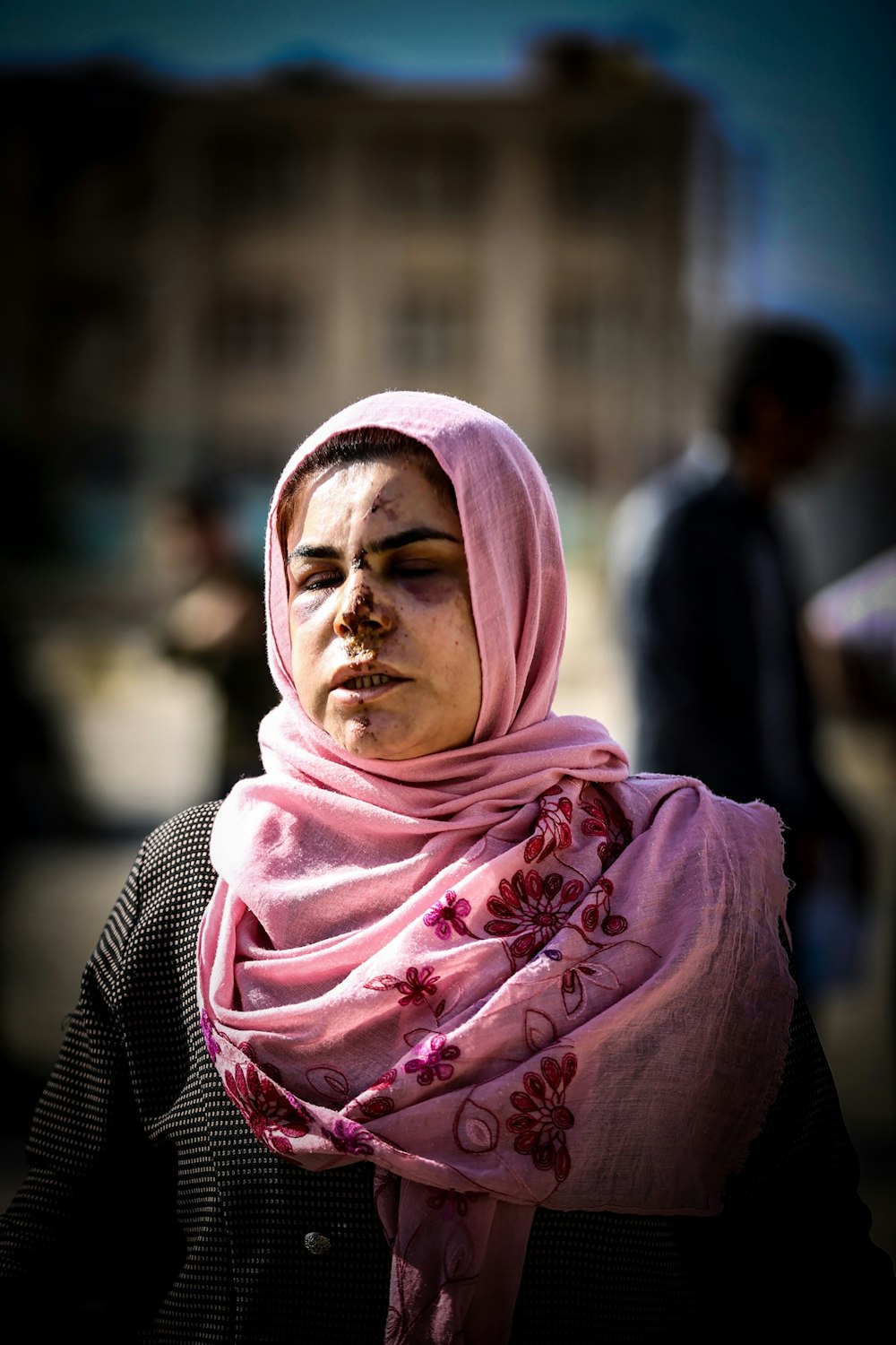 woman in pink hijab standing