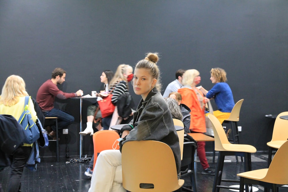 people sitting on chair inside room