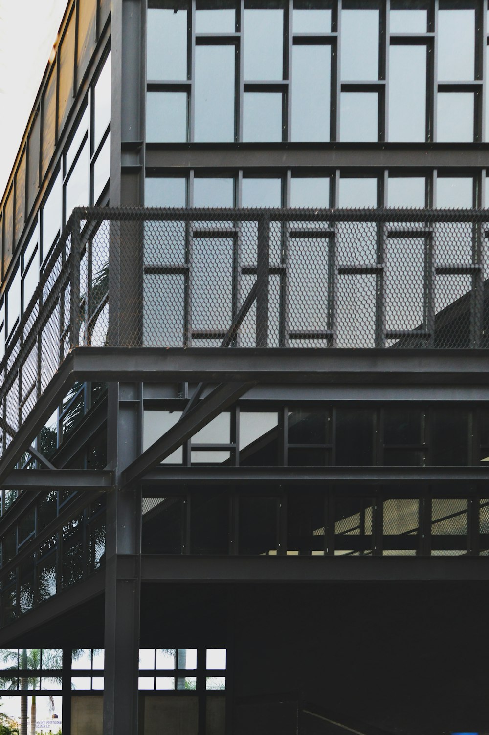 black metal frame on orange and white building