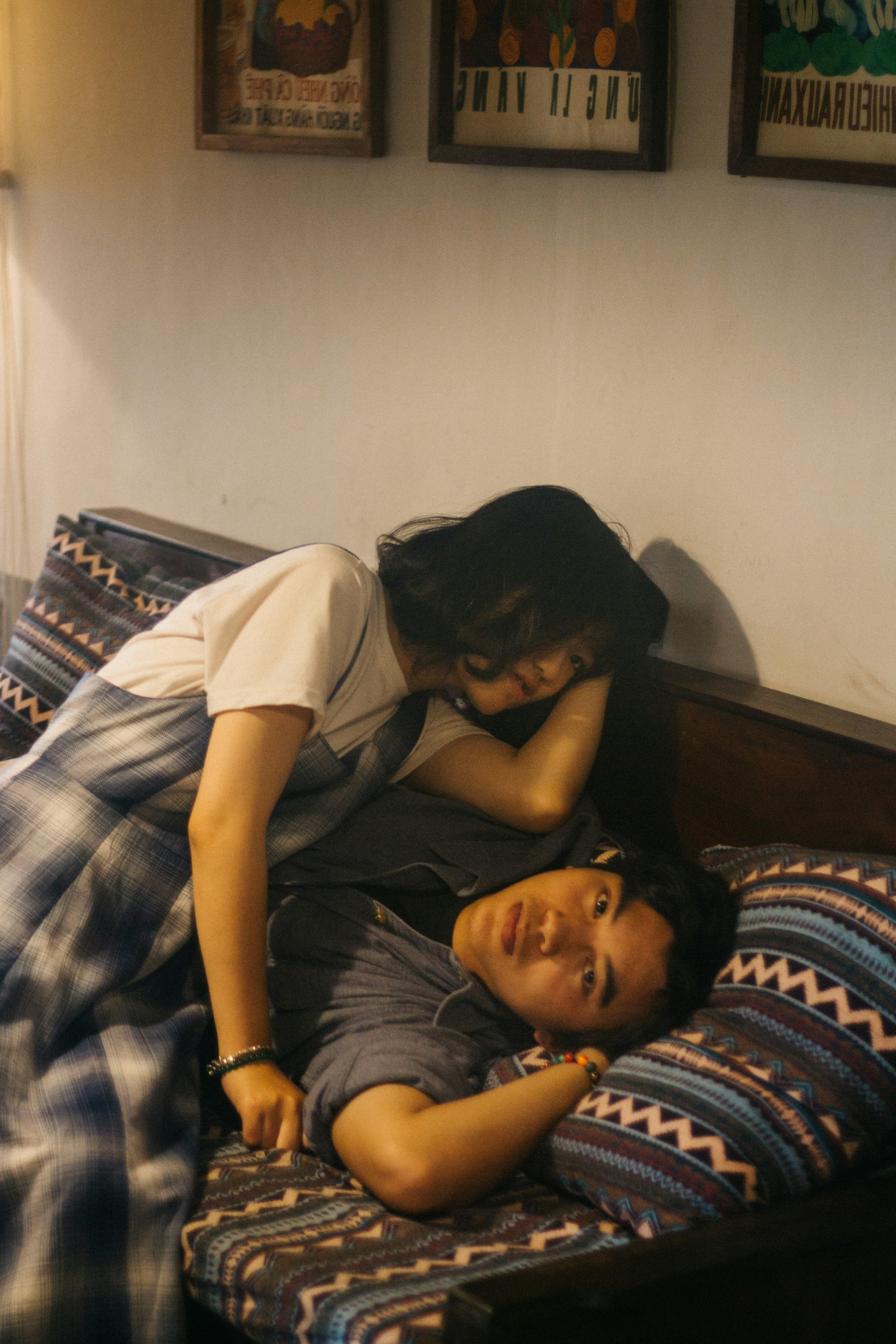 man in white crew neck t-shirt lying on bed