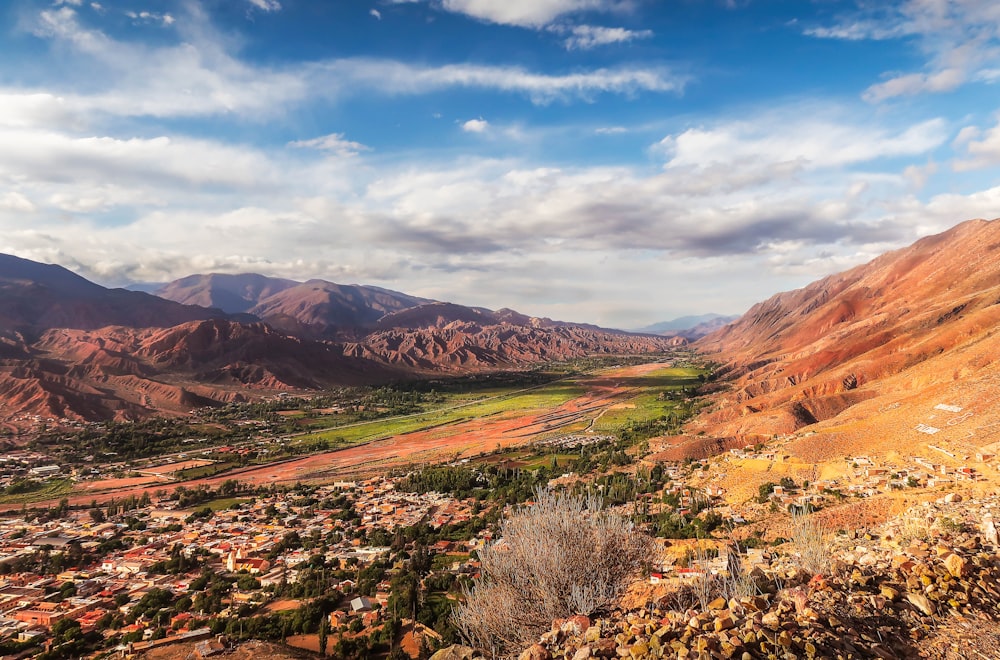 brown and green mountains under blue sky during daytime