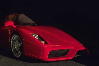 A glossy red sports car with enhanced reflections and sharp details.