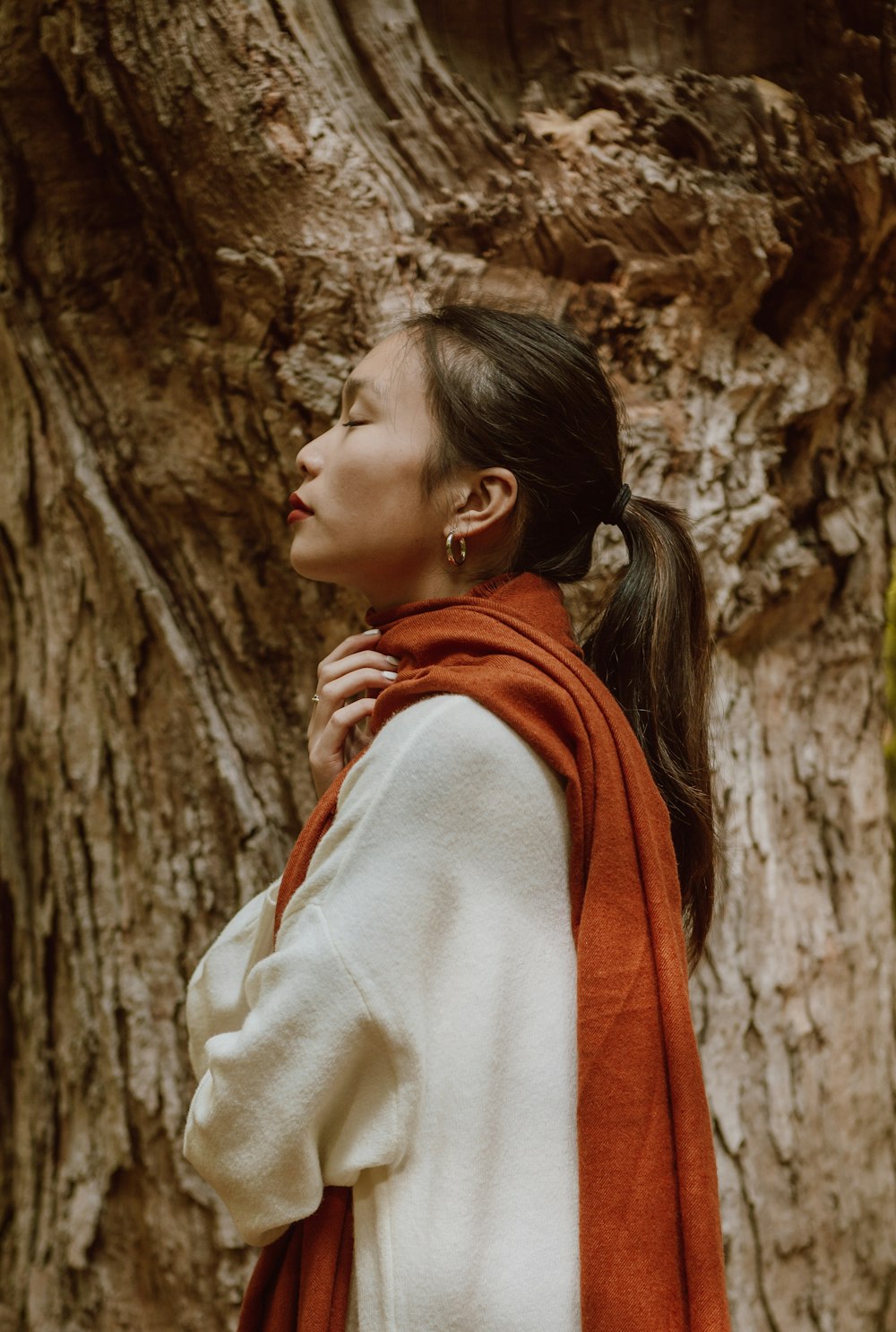 woman in white and red scarf