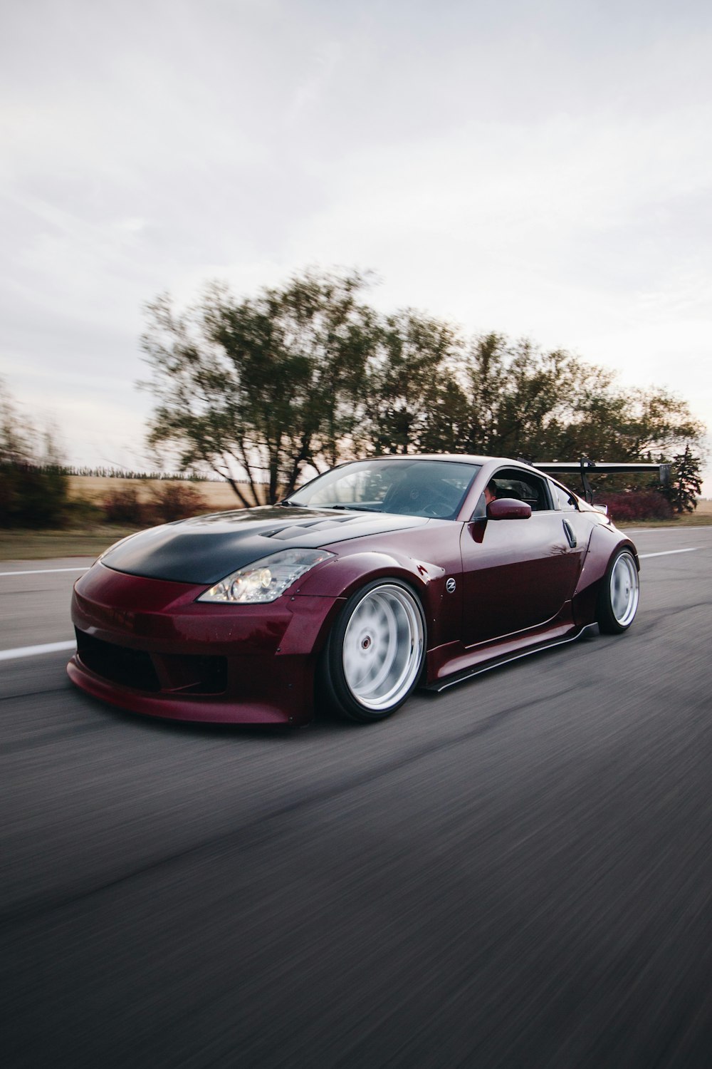 red ferrari 458 italia on road during daytime