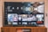 A television screen displaying the Netflix interface is shown. The main focus is the show 'Dark' with a large image from the series. Below it are recommendations for 'Continue Watching,' including shows like 'Selling Sunset,' 'Friends,' and 'Community.' The interface includes the Netflix logo and an array of show thumbnails.