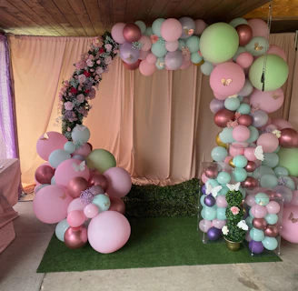 A cheerful balloon arch framing a cozy event space, inviting guests to celebrate.