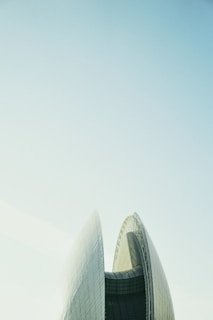 The exterior of the myzh technology office building under a clear sky, showcasing its modern architecture.