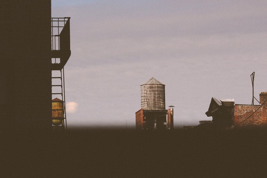 silhouette of building during sunset