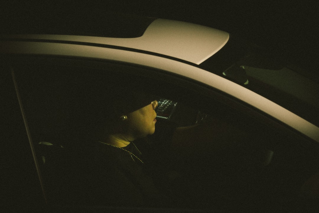 person in car during night time