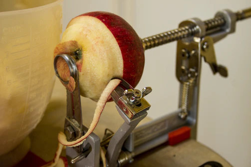 Peeling machines operating with precision on a fruit processing line.