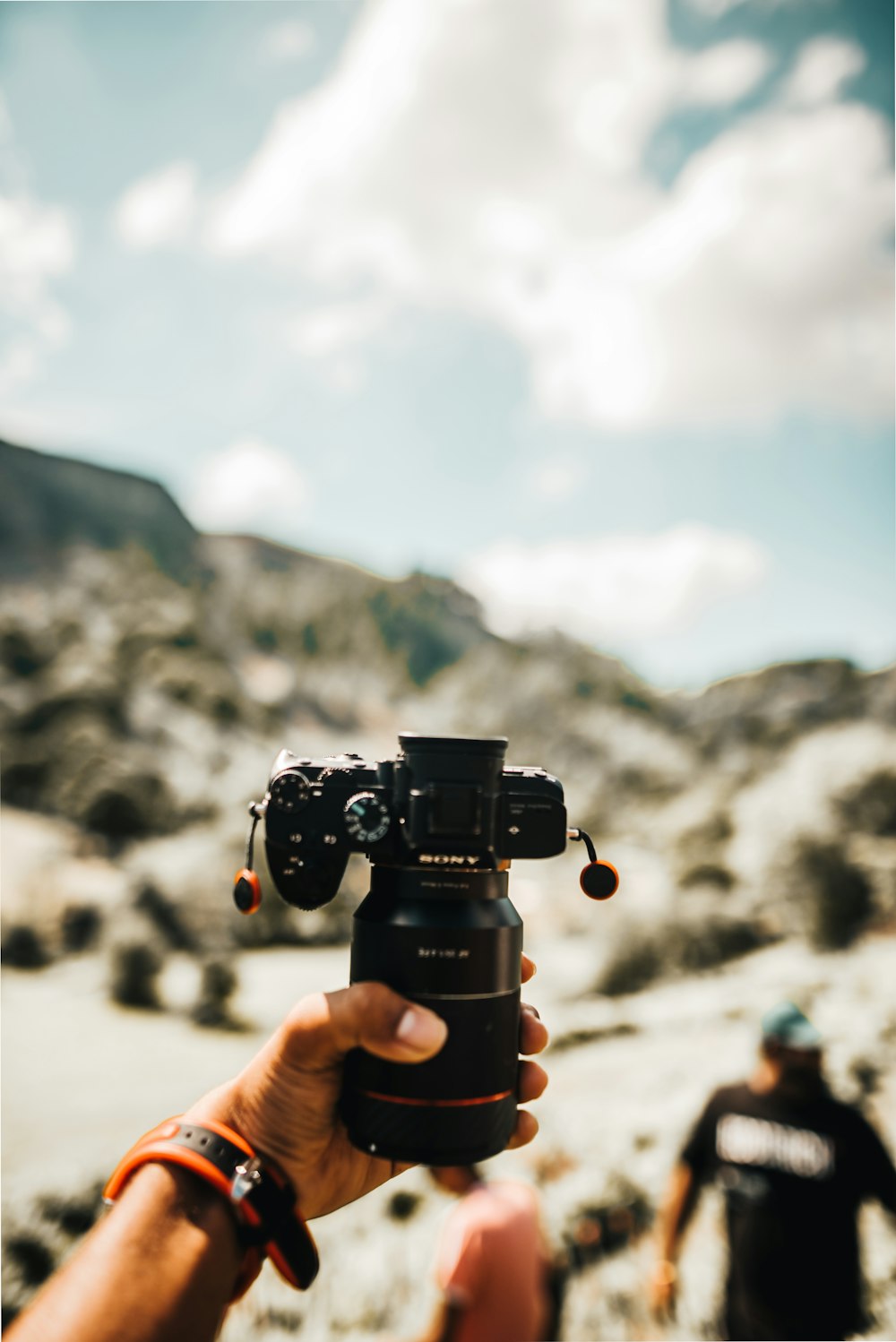 person holding black dslr camera