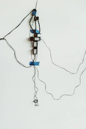 A neat arrangement of wireless access points mounted on a wall in an office setting