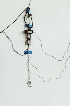 A neat arrangement of wireless access points mounted on a wall in an office setting