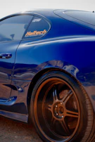 Close-up of a Haltech tuning laptop connected to a Supra’s ECU during a live tuning session.