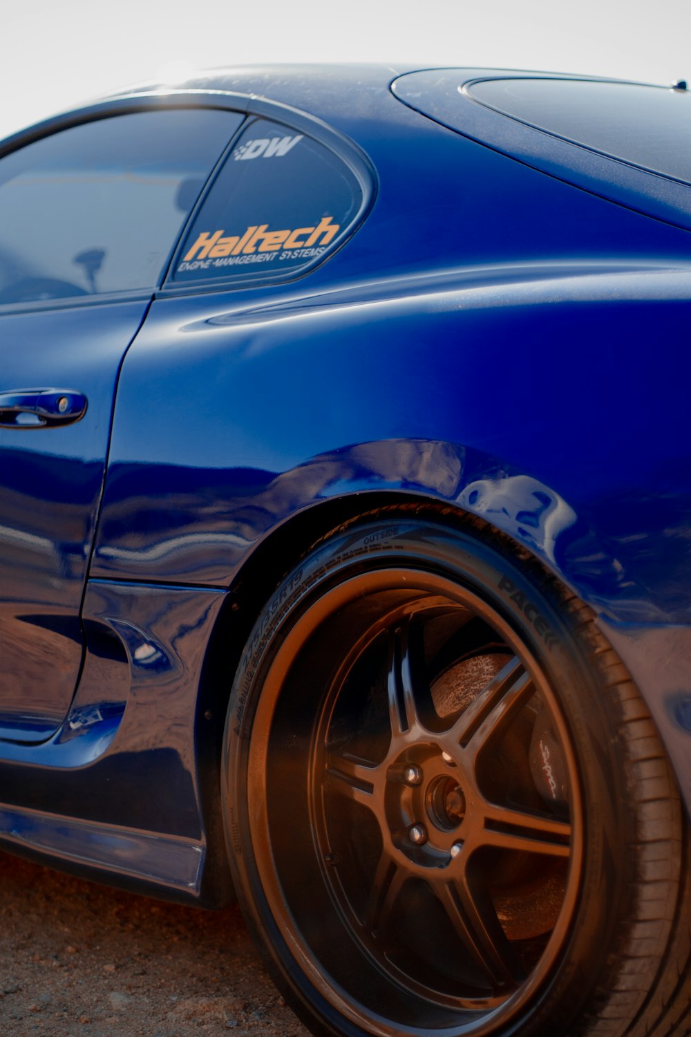 blue car with chrome wheel