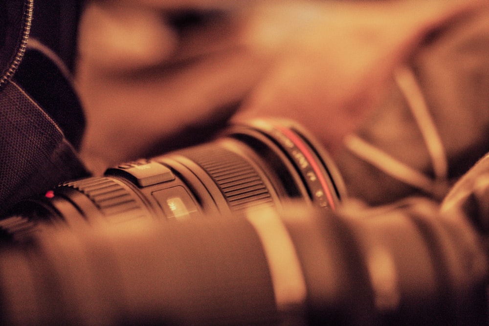 black and white camera lens on brown textile