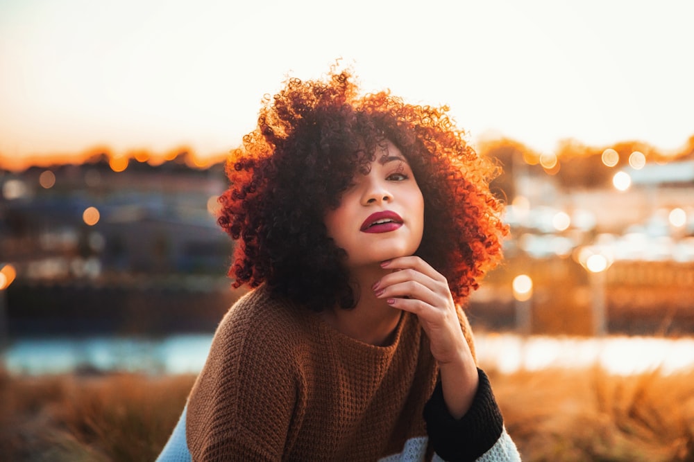 woman in brown knit sweater