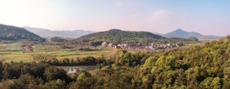 A serene landscape showing a rural community with children.