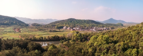 A serene landscape showing a rural community with children.