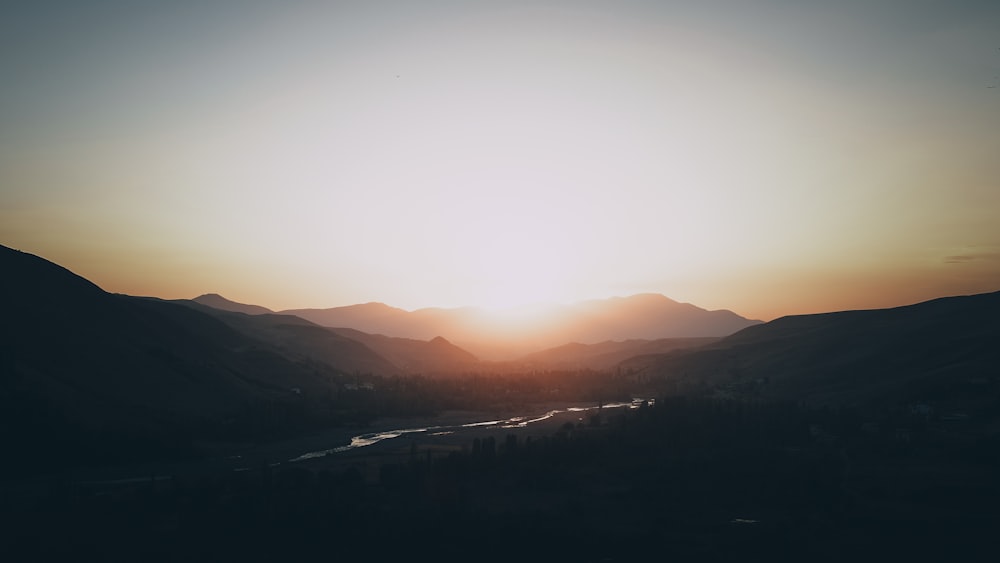 silhouette of mountains during sunset