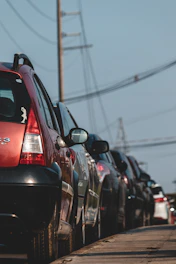 red suv on road during daytime