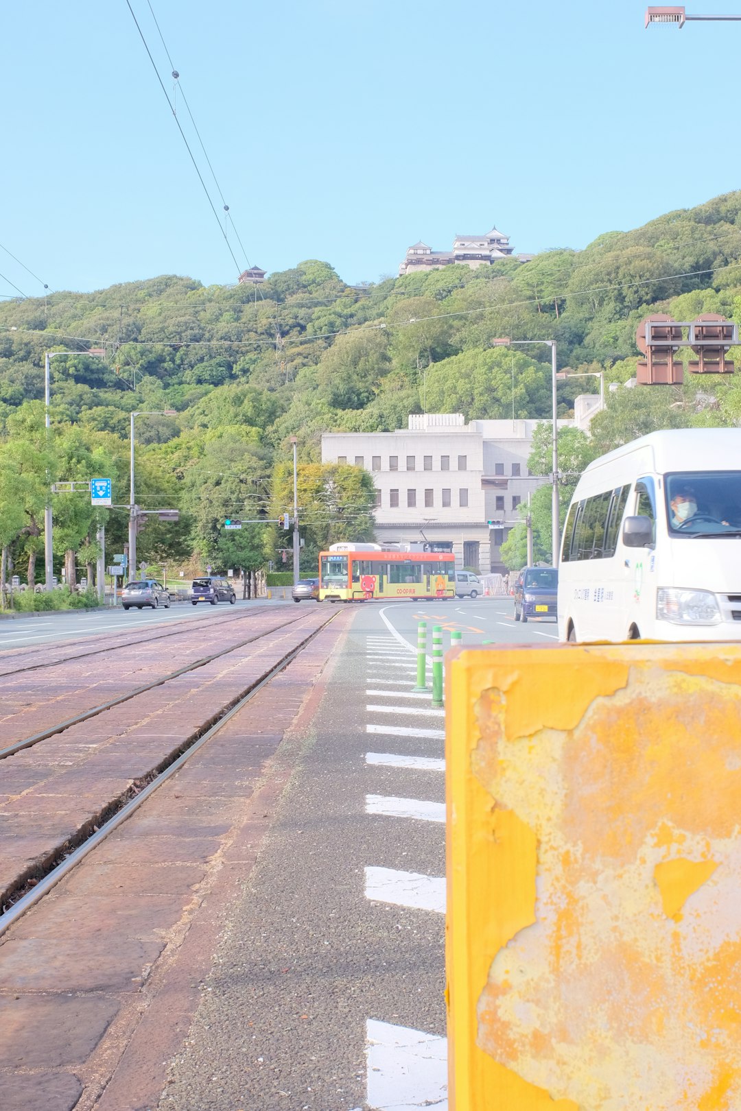 white and yellow train on rail road during daytime