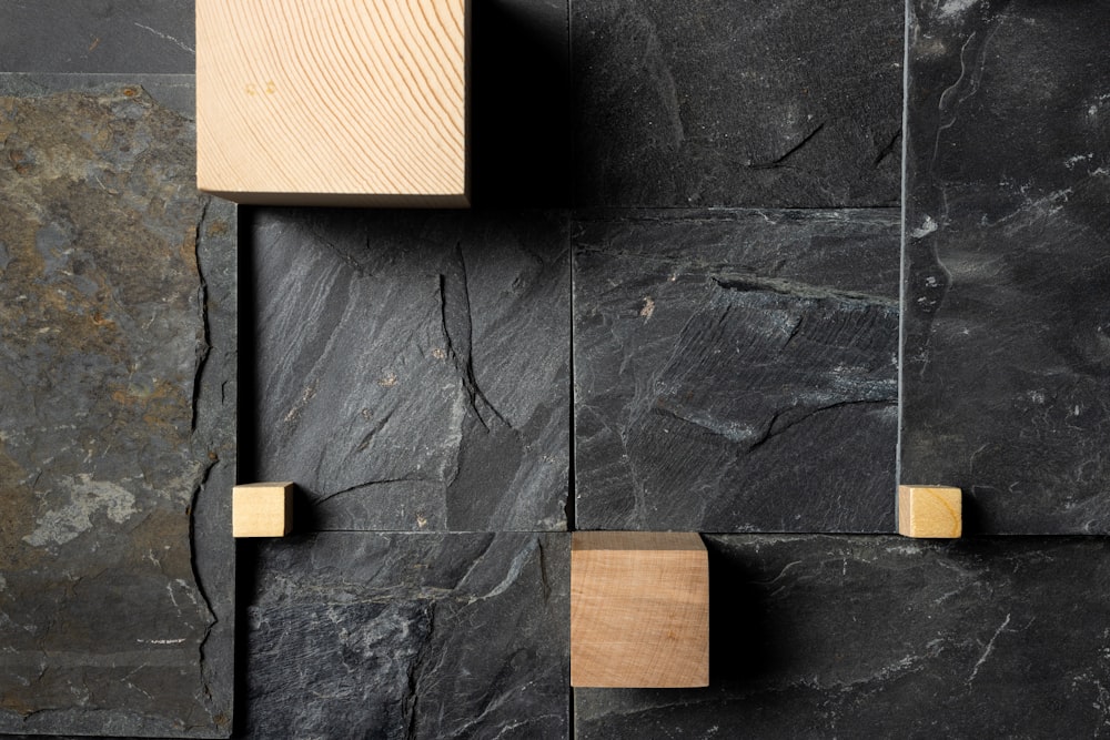 brown wooden board on blue concrete wall