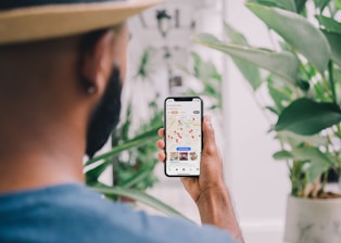 person holding silver iphone 6