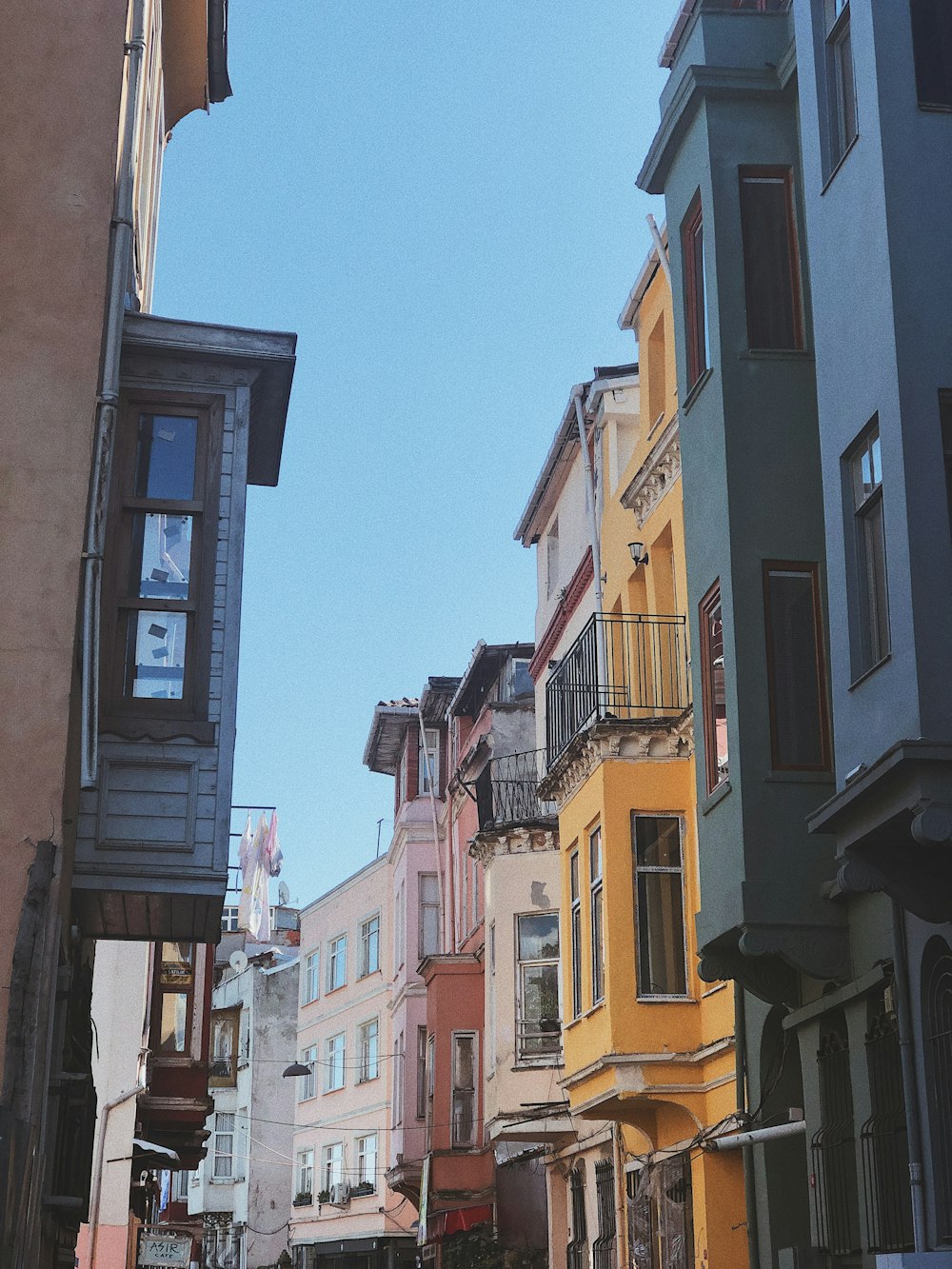 yellow and brown concrete buildings under blue sky during daytime