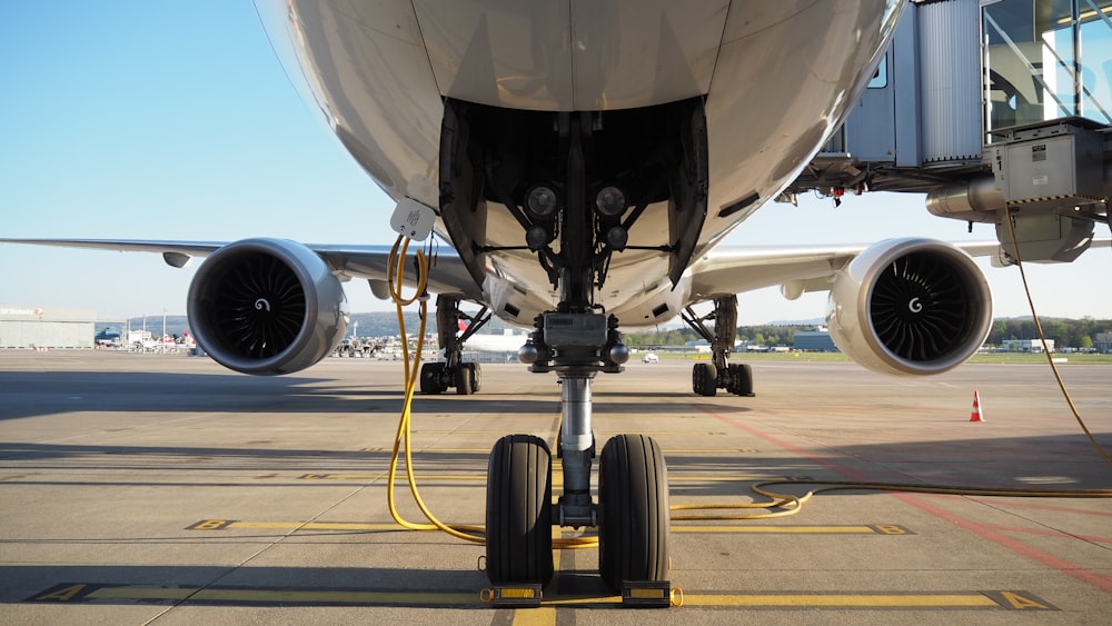 black airplane on the airport during daytime