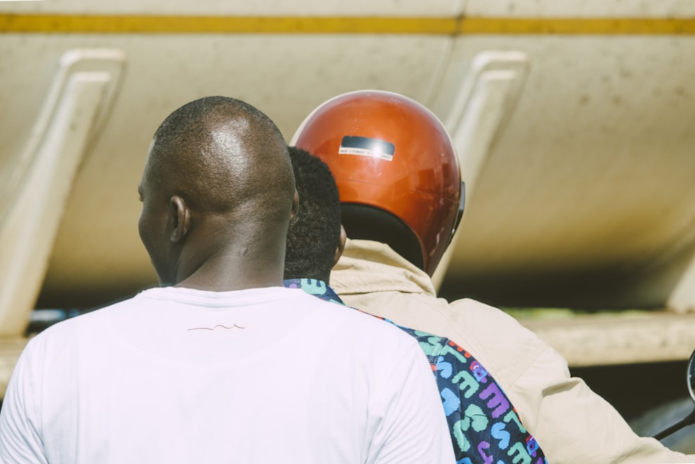 man in white shirt wearing red helmet