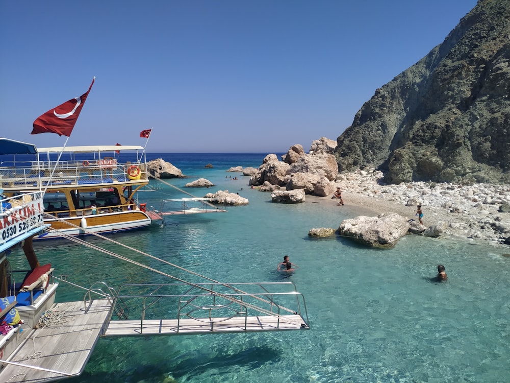 people riding on boat on sea during daytime