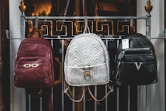 brown leather backpack on brown wooden table