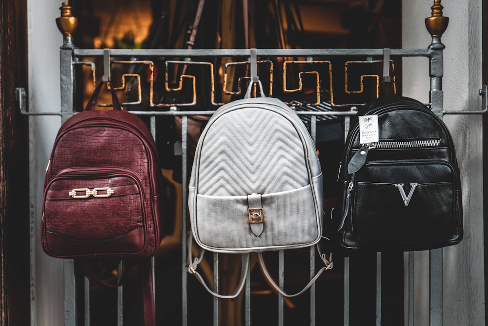 brown leather backpack on brown wooden table