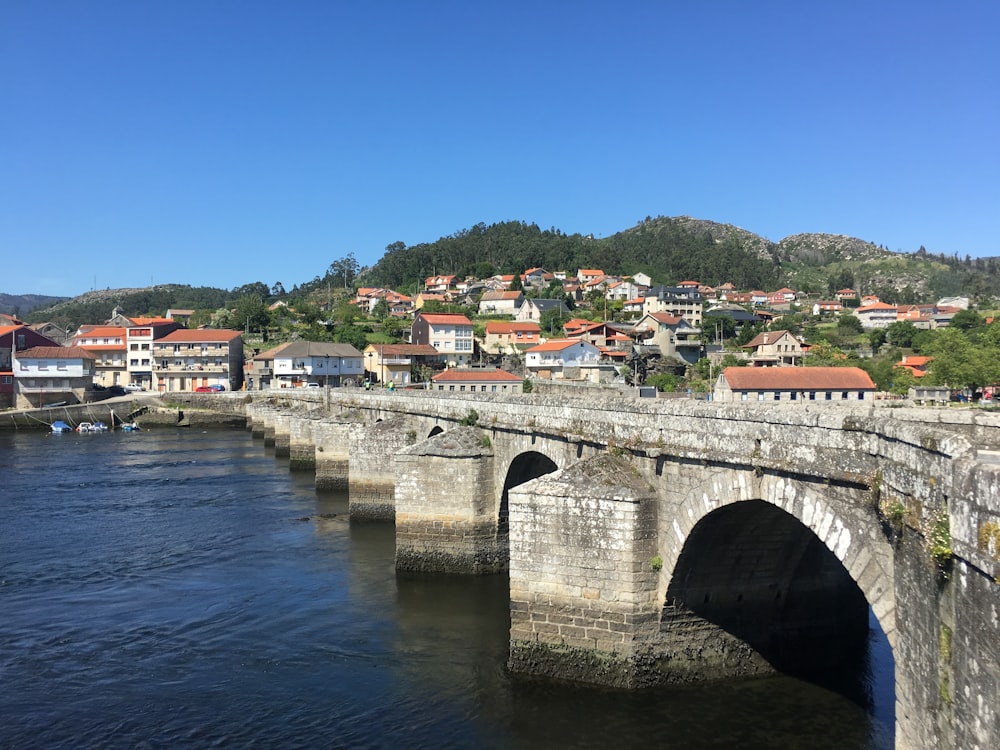 white and brown concrete bridge over river during daytime