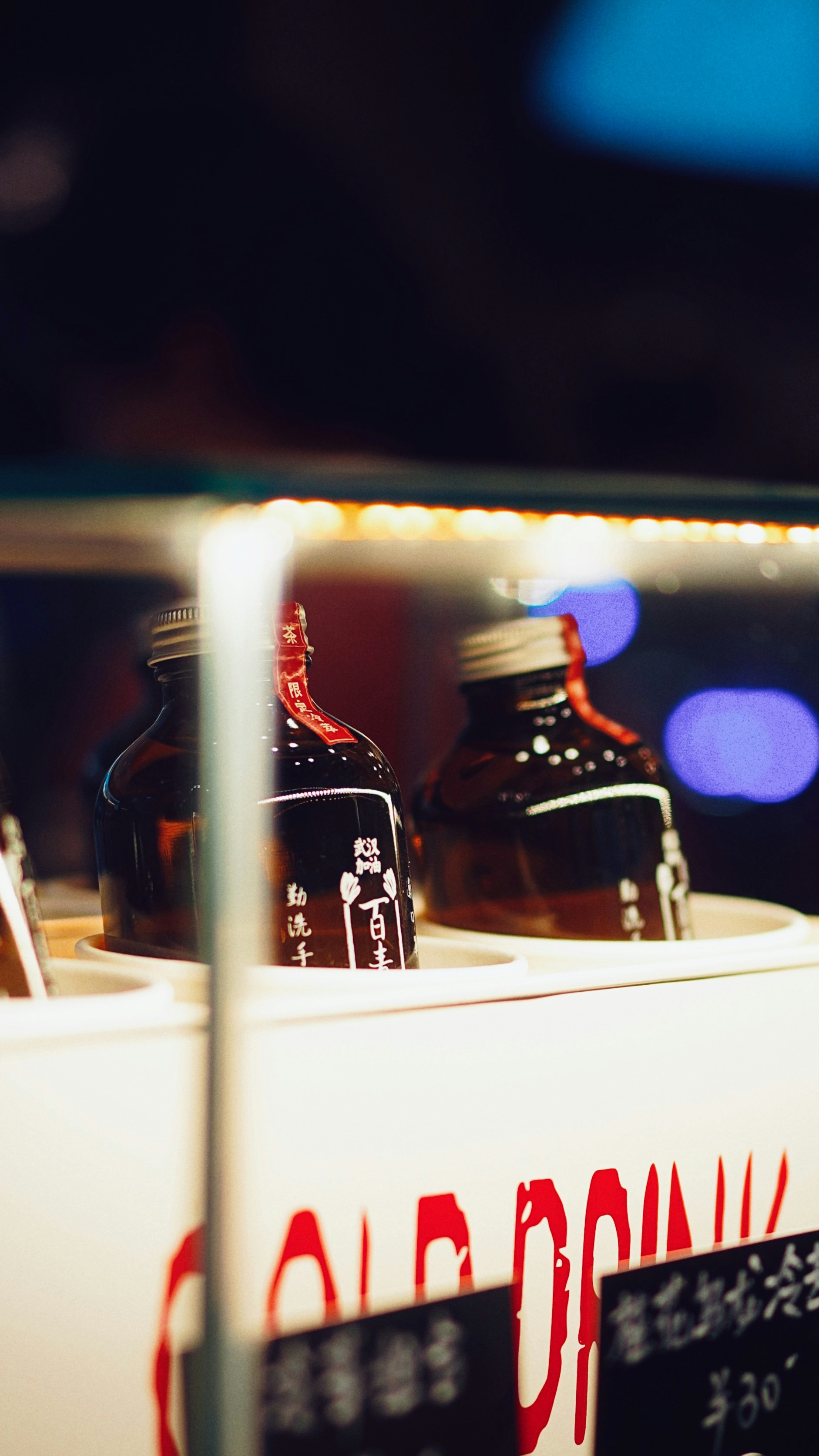 black glass bottles on white table