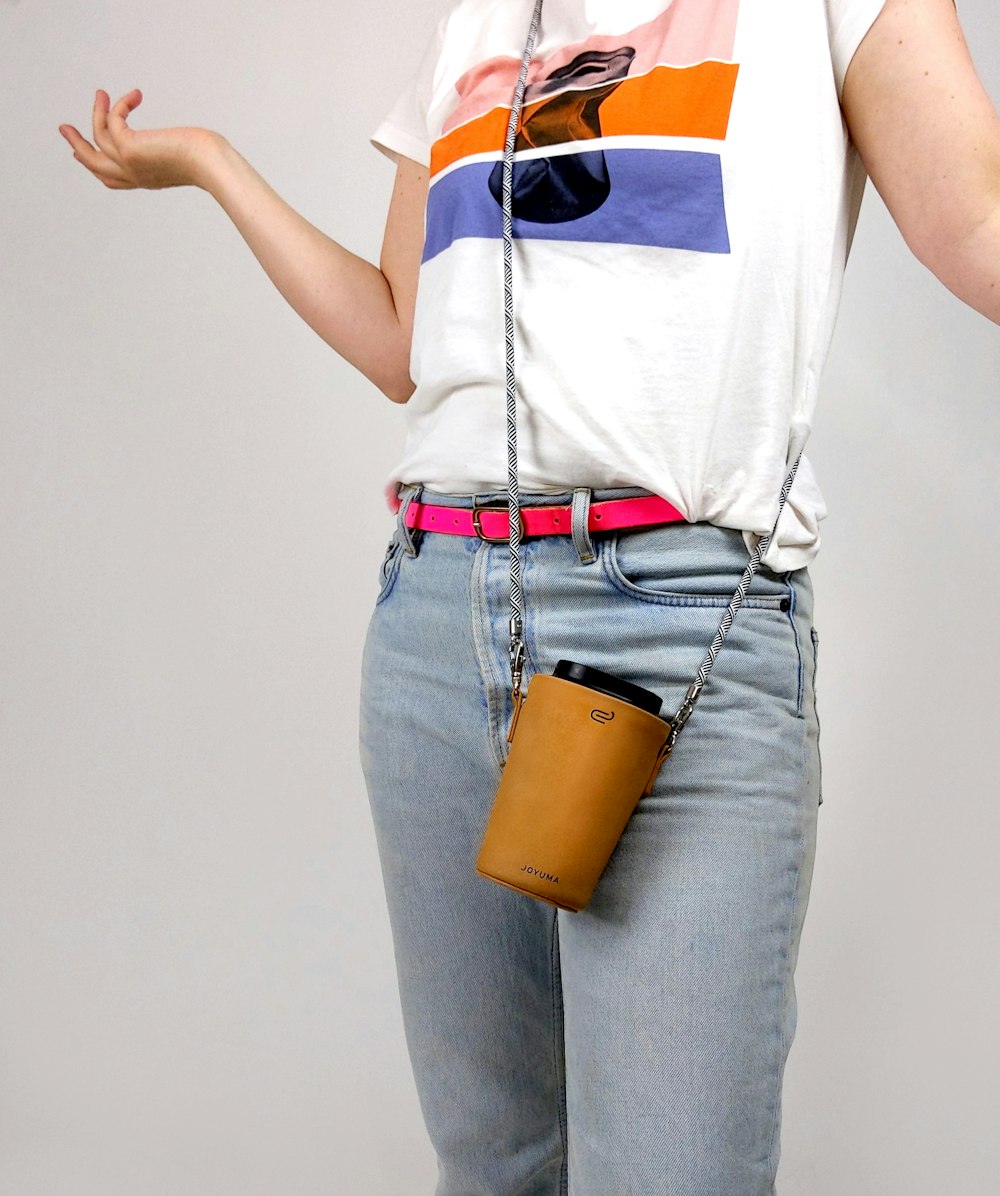 woman in white shirt and blue denim jeans