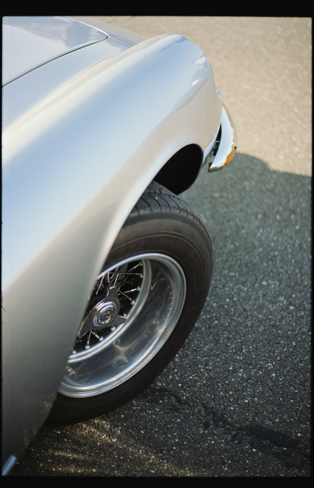 grey car with chrome wheel